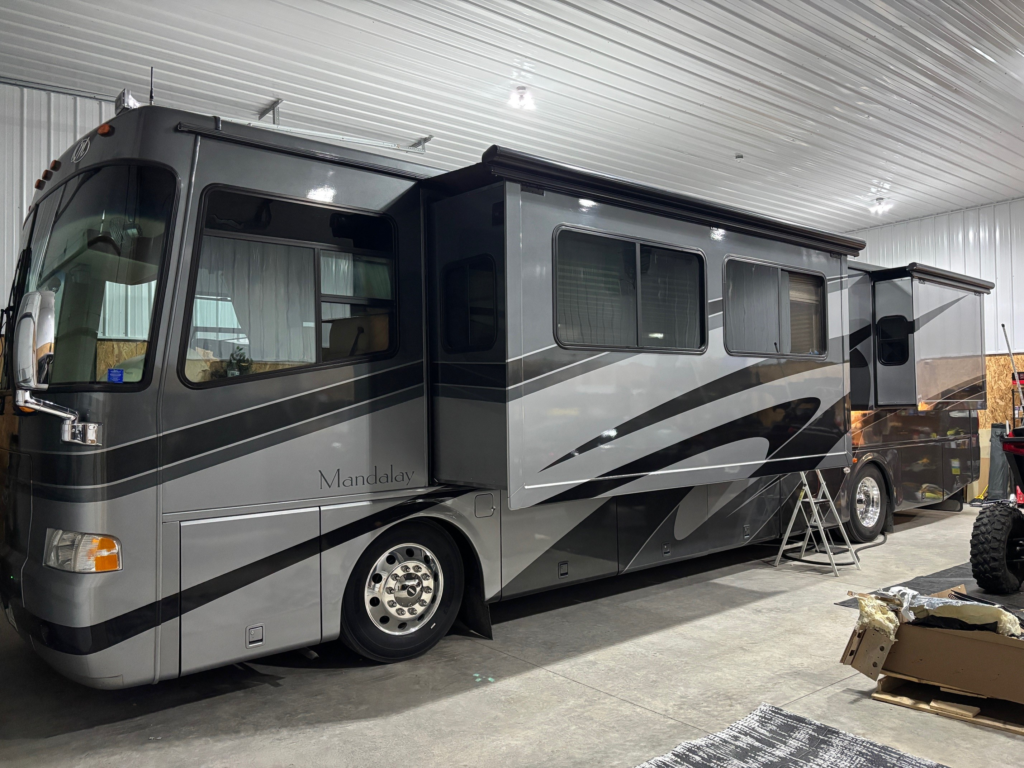 class motorhome parked in my shop
