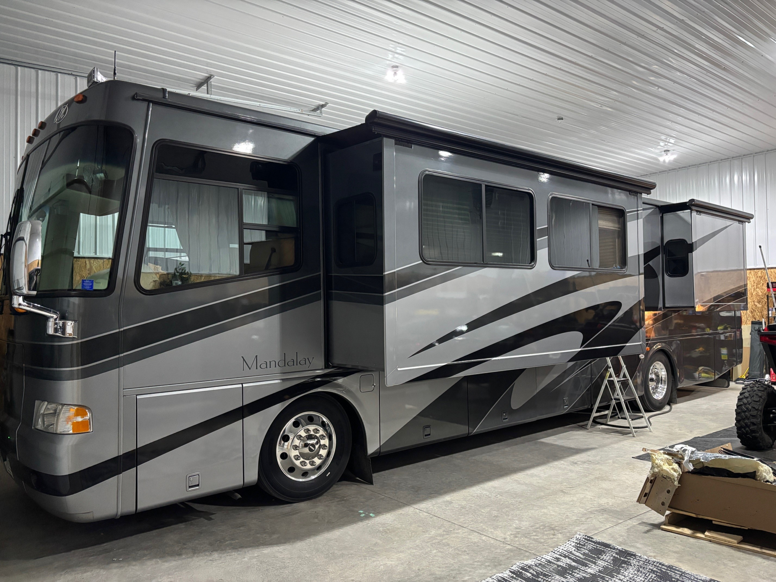 class motorhome parked in my shop